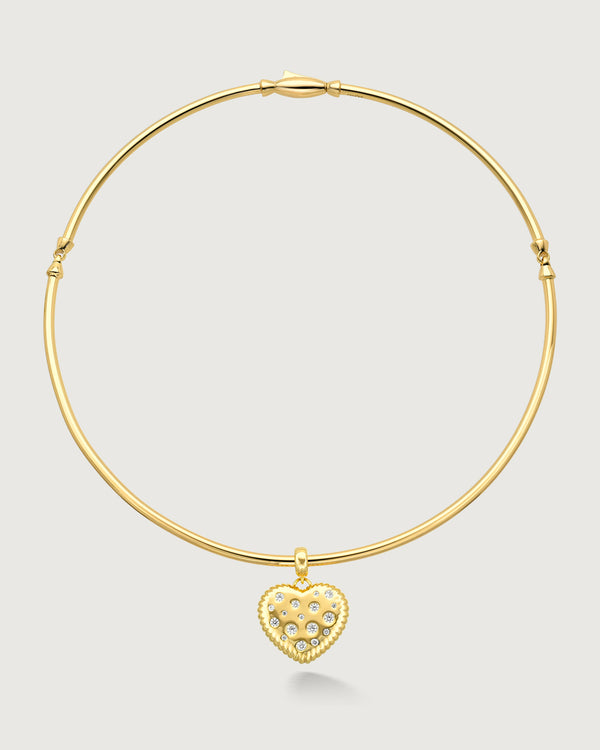 product photo of a gold choker with a heart shaped charm by Camóre