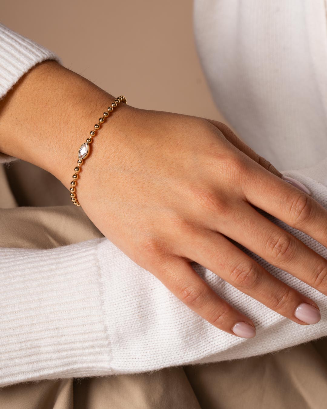 close up a model wearing the marquise beaded bracelet by Camóre