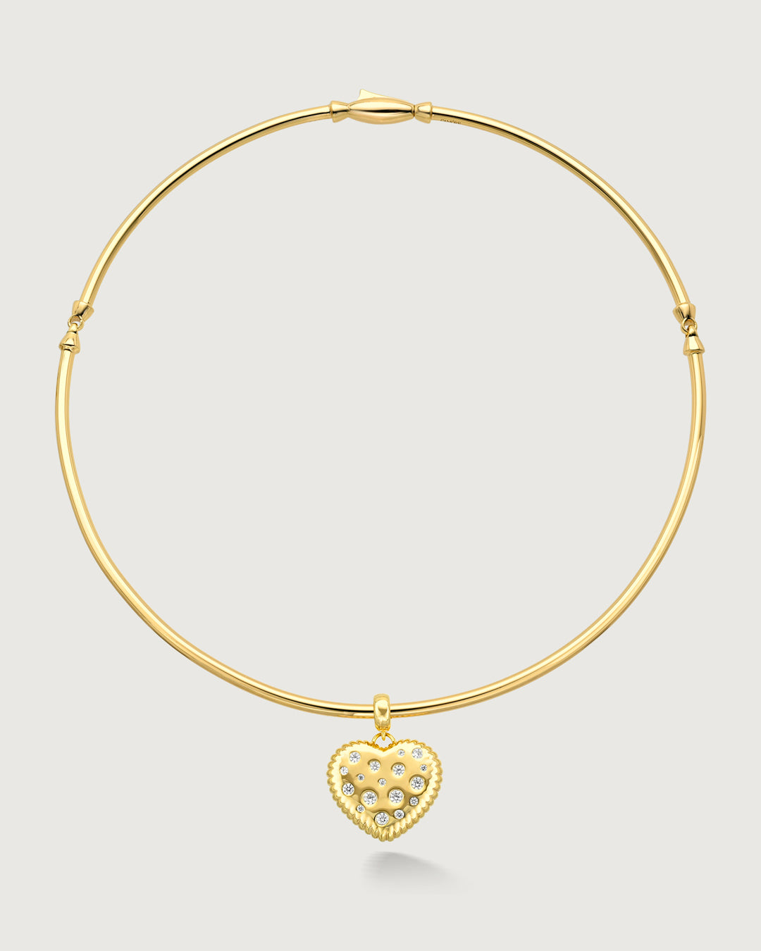 product photo of a gold choker with a heart shaped charm by Camóre