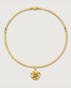Gold choker with rose charm by Camóre on a white background