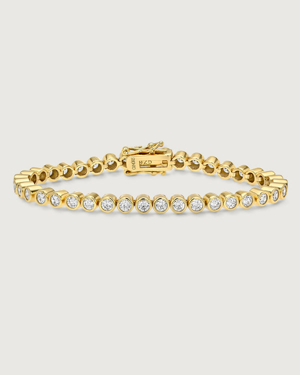 Camóre Axis Bracelet product photo, a gold bezel-set tennis bracelet