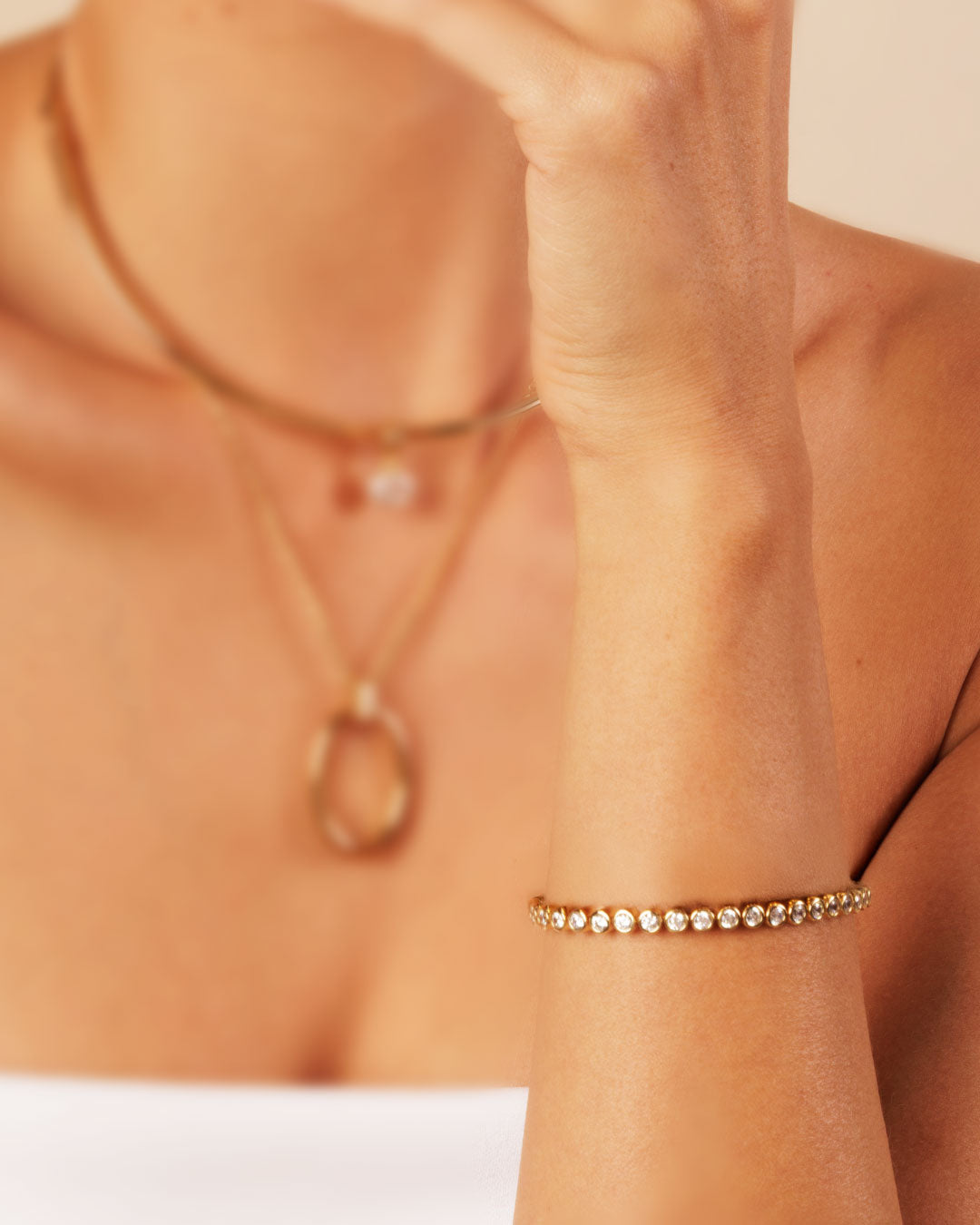 Close-up of the Camóre Axis Bracelet, a gold bezel-set tennis bracelet