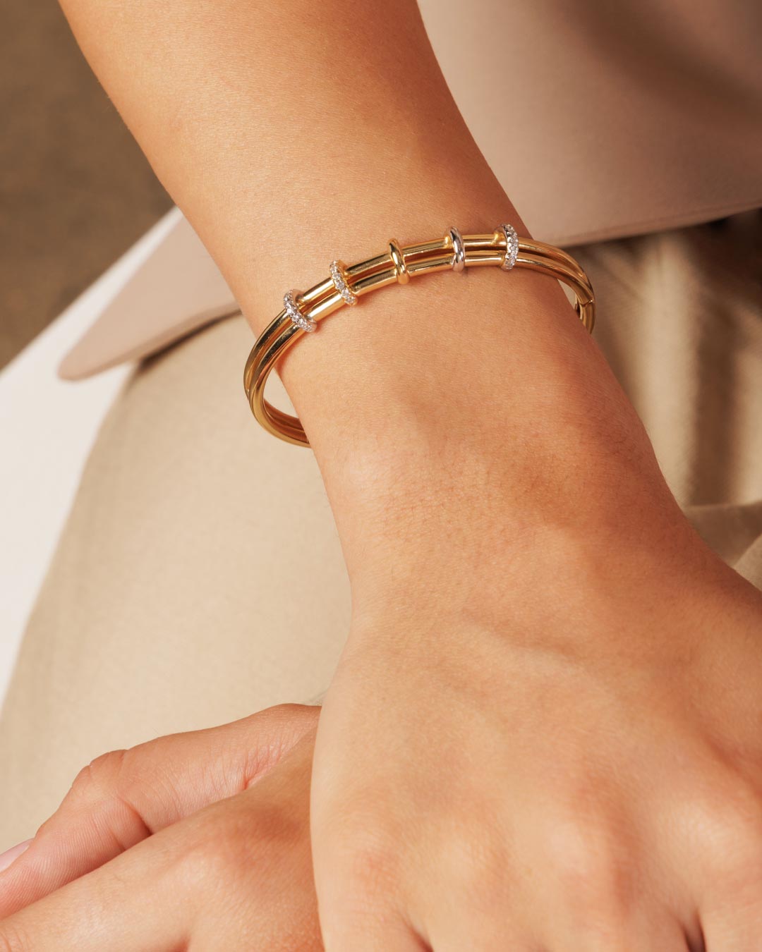 mixed metal cuff bracelet by Camóre on a model's wrist