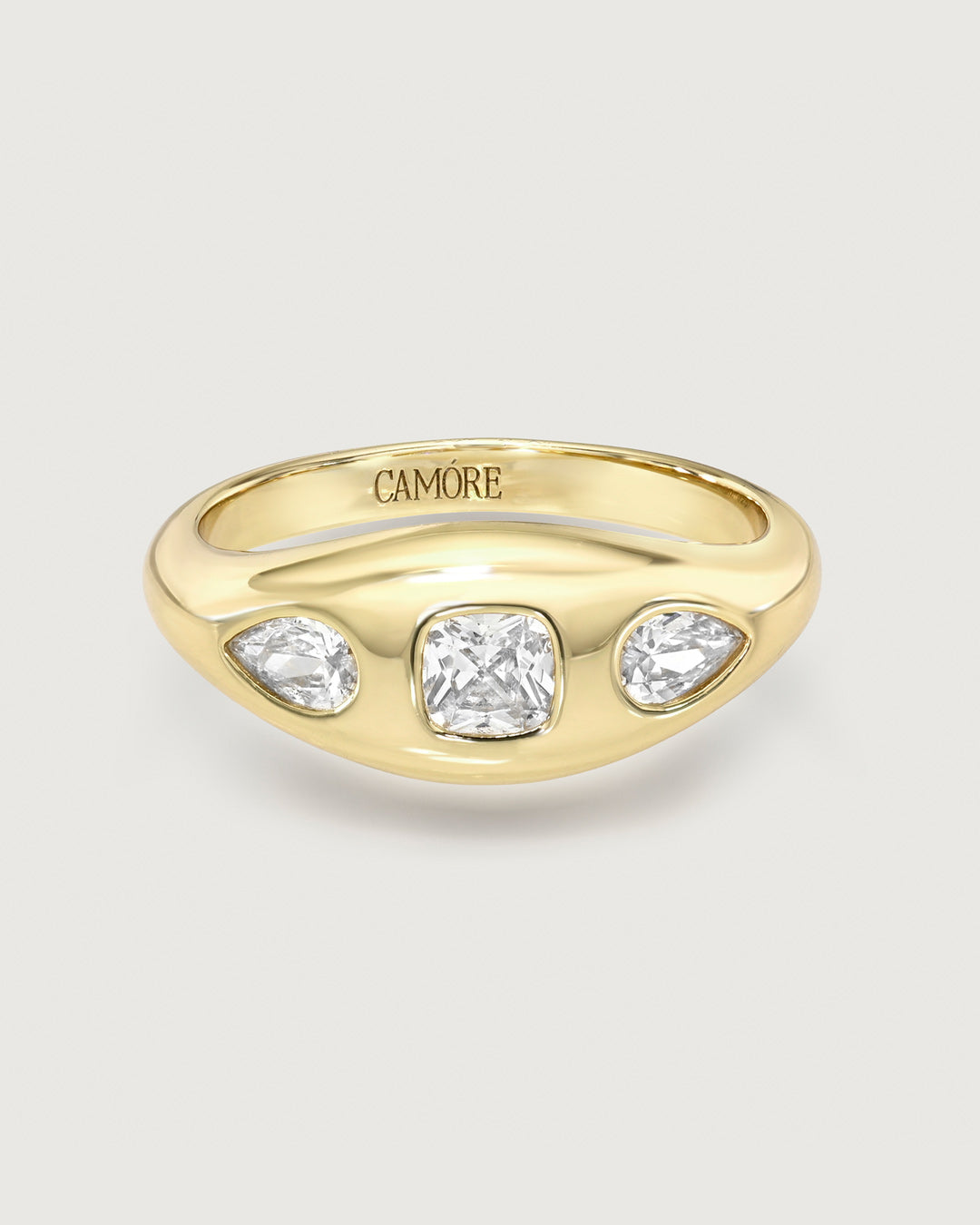 product photo of a gold ring with 3 mixed cut stones in a gypsy setting